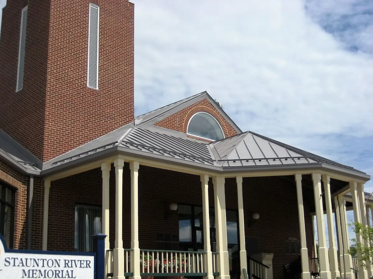 Skilled roofing craftsmen working on a residential roof in West Pensacola